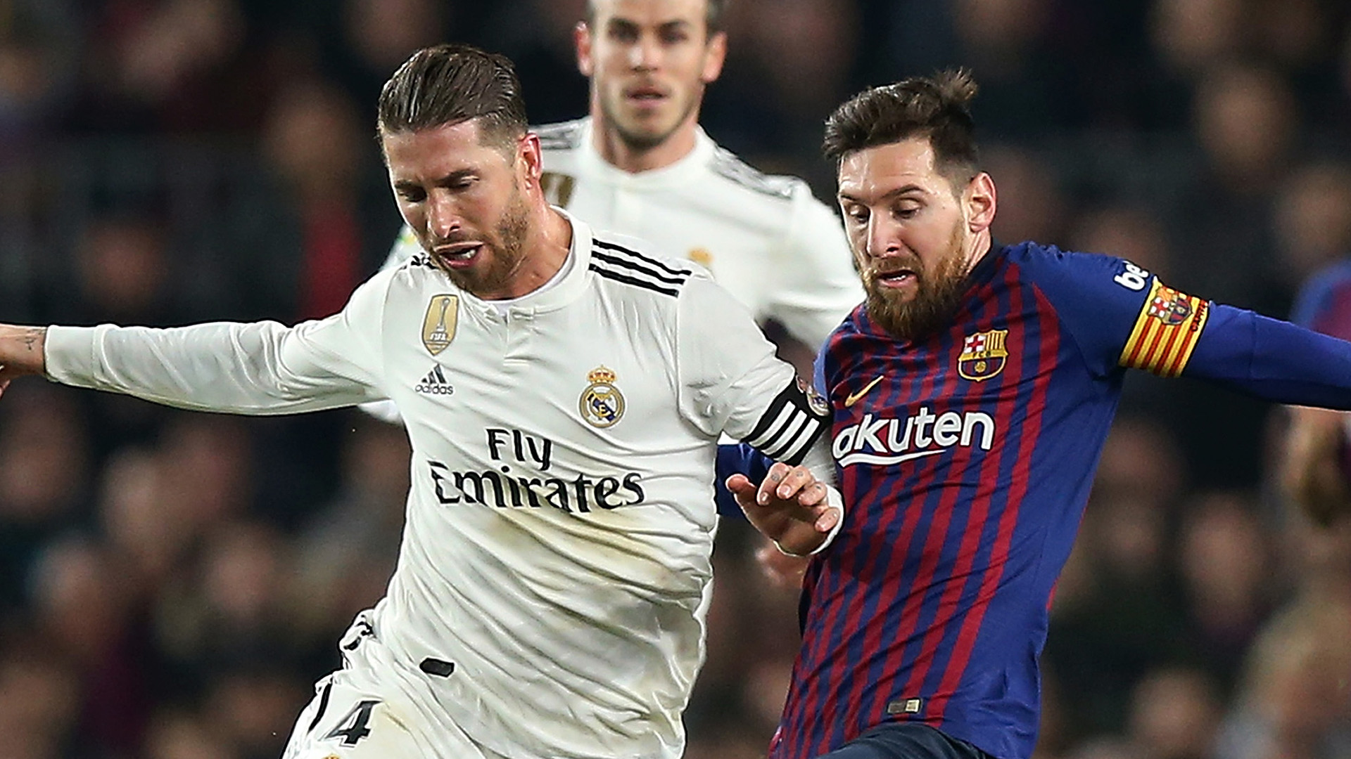 BARCELONA, SPAIN - FEBRUARY 06: Lionel Messi of FC Barcelona competes for the ball with Sergio Ramos of Real Madrid CF during the Copa del Rey Semi Final match between FC Barcelona and Real Madrid at Nou Camp on February 06, 2019 in Barcelona, Spain. (Photo by Angel Martinez/Getty Images)